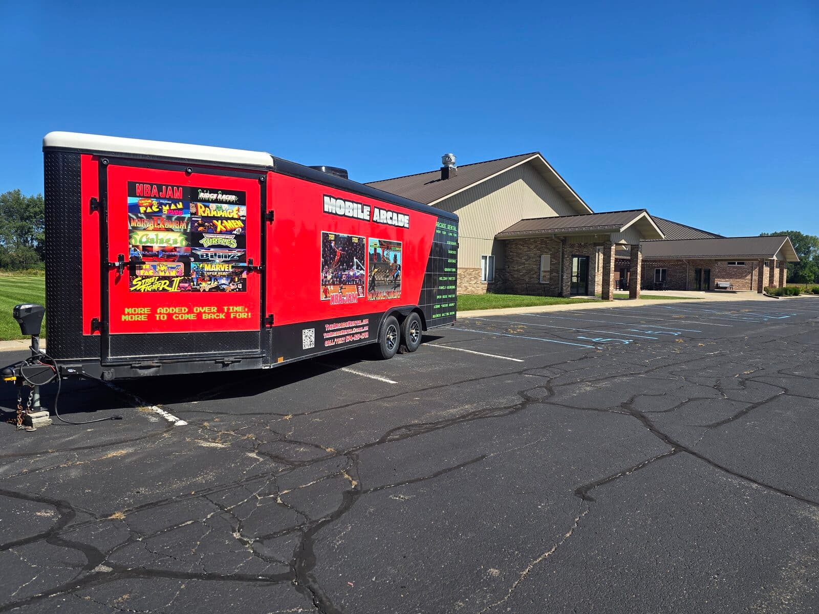 The Arcade Rental mobile arcade trailer parked outside a youth group event, ready for guests